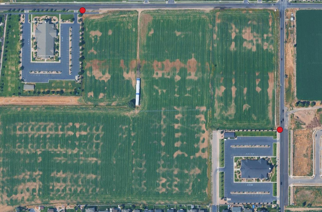Aerial view of the temple site with red dots marking where curb lines should start and end between the two church buildings