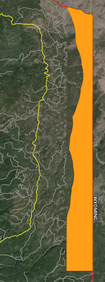 Orange search area polygon along the Wyoming border east of the yellow Fish Creek Road selection