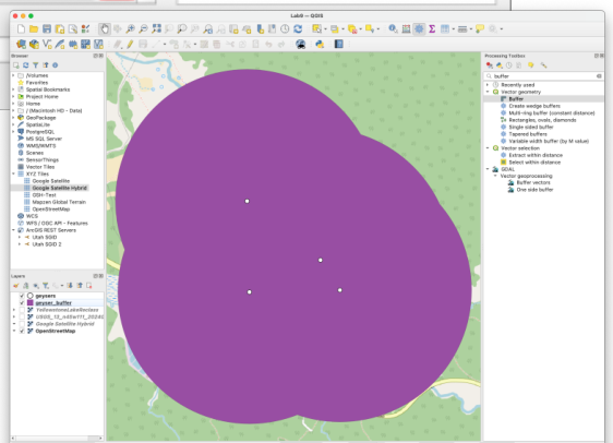 QGIS window showing the dissolved 1 km buffer around the four geyser points as a single purple polygon
